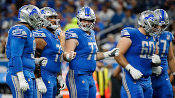 Detroit Lions center Frank Ragnow (77), center, fist bumps the offensive line before a play against Atlanta Falcons during the first half at Ford Field in Detroit on Sunday, Sept. 24, 2023.