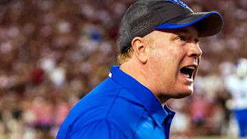 Oct 5, 2013; Columbia, SC, USA; Kentucky Wildcats head coach Mark Stoops disputes a call against the South Carolina Gamecocks in the second quarter at Williams-Brice Stadium. Mandatory Credit: Jeff Blake-Imagn Images