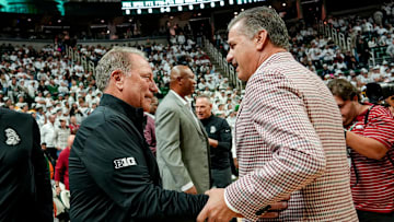 Michigan State's coach Tom Izzo, left, and Arkansas' head coach John Calipari meet before the game on Saturday, Nov. 8, 2025, at the Breslin Center in East Lansing.