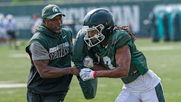 Michigan State's Rodney Bullard Jr. (3) is blocked at a practice with pads at the Michigan State practice field Tuesday, Aug. 5, 2025.