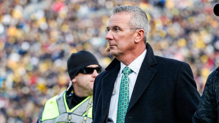 Nov 25, 2023; Ann Arbor, MI, USA;  Ohio State Buckeyes former head coach Urban Meyer walks by the end zone during the first half between Michigan and Ohio State at Michigan Stadium in Ann Arbor on Saturday, Nov. 25, 2023. 