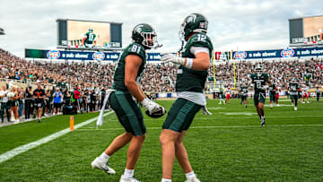 Michigan State's Michael Masunas, left, celebrates his touchdown catch with Jack Velling against Youngstown State during the third quarter on Saturday, Sept. 13, 2025, at Spartan Stadium in East Lansing.