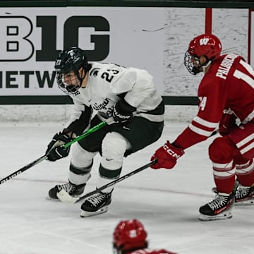 MSU's Shane Vansaghi moves the puck against Wisconsin, Thursday, Jan. 2, 2024, at Munn Ice Arena. MSU won 4-3.