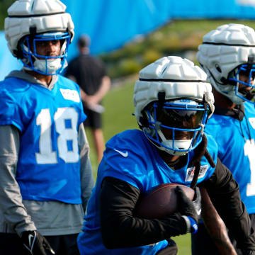 Detroit Lions wide receiver Daurice Fountain runs during drills 