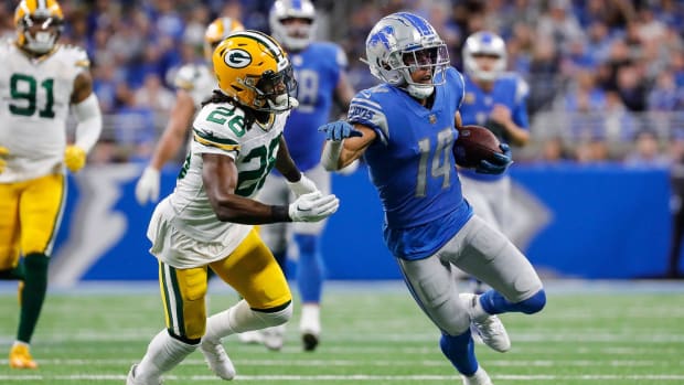 Detroit Lions wide receiver Amon-Ra St. Brown (14) makes a catch against the Green Bay Packers 