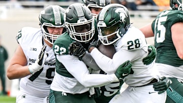 Michigan State's Bai Jobe, left, tackles Brandon Tullis during the Spring Showcase on Saturday, April 20, 2024, at Spartan Stadium in East Lansing.