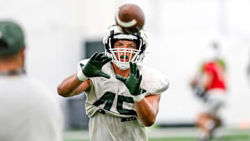 Michigan State's Brady Pretzlaff catches a ball in a drill during camp on Monday, Aug. 5, 2024, at the indoor practice facility in East Lansing.