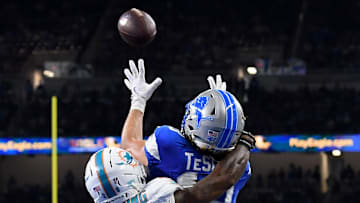 Aug 16, 2025; Detroit, Michigan, USA; Detroit Lions wide receiver Isaac TeSlaa (18) scores a touchdown against the Miami Dolphins in the second quarter at Ford Field. Mandatory Credit: Eamon Horwedel-Imagn Images