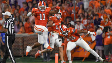 Clemson defensive lineman T.J. Parker (12) reacts with defensive lineman Peter Woods (11) after sacking Florida Atlantic quarterback Daniel Richardson (10) during the second quarter Sep 16, 2023; Clemson, South Carolina, USA; at Memorial Stadium.