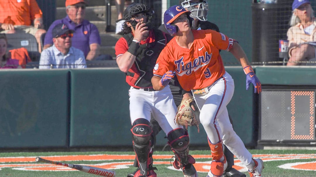 Clemson catcher Jacob Jarrell (9) hits a home run against University of Louisville during the bottom of the fifth inning at Doug Kingsmore Stadum in Clemson, S.C. Friday, April 18, 2025. The home run broke up a no-hitter and helped the Tigers win 2-1. Clemson catcher Jacob Jarrell (9) hits a home run against University of Louisville during the bottom of the fifth inning at Doug Kingsmore Stadum in Clemson, S.C. Friday, April 18, 2025. The home run broke up a no-hitter and helped the Tigers win 2-1.