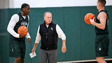 Michigan State's coach Tom Izzo, left, talks with Coen Carr, left, and Denham Wojcik during the first day of basketball practice on Monday, Sept. 22, 2025, at the Breslin Center in East Lansing.