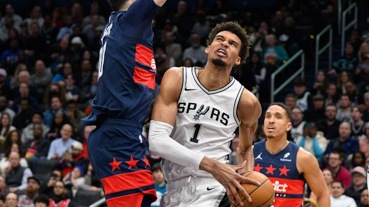 Feb 10, 2025; Washington, District of Columbia, USA; San Antonio Spurs center Victor Wembanyama (1) drives to the basket against Washington Wizards forward Tristan Vukcevic (00) during the second quarter at Capital One Arena. Mandatory Credit: Reggie Hildred-Imagn Images Feb 10, 2025; Washington, District of Columbia, USA; San Antonio Spurs center Victor Wembanyama (1) drives to the basket against Washington Wizards forward Tristan Vukcevic (00) during the second quarter at Capital One Arena. Mandatory Credit: Reggie Hildred-Imagn Images