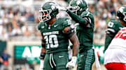 Michigan State's Wayne Matthews III, left, celebrates with Nikai Martinez after a tackle against Youngstown State during the third quarter on Saturday, Sept. 13, 2025, at Spartan Stadium in East Lansing.