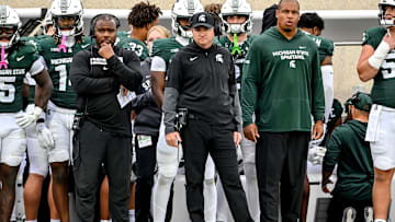 Michigan State's head coach Jonathan Smith, center, looks on from the sideline during the third quarter in the game against UCLA on Saturday, Oct. 11, 2025, at Spartan Stadium in East Lansing.