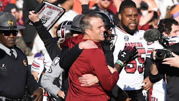 Nov 30, 2024; Clemson, South Carolina, USA; Clemson head coach Dabo Swinney and South Carolina Head Coach Shane Beamer talk after the game at Memorial Stadium. Mandatory Credit: Ken Ruinard-Imagn Images