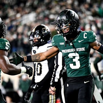 Michigan State's Montorie Foster Jr., right, celebrates with Nathan Carter, left, after Carter's touchdown against Purdue during the second quarter on Friday, Nov. 22, 2024, at Spartan Stadium in East Lansing.