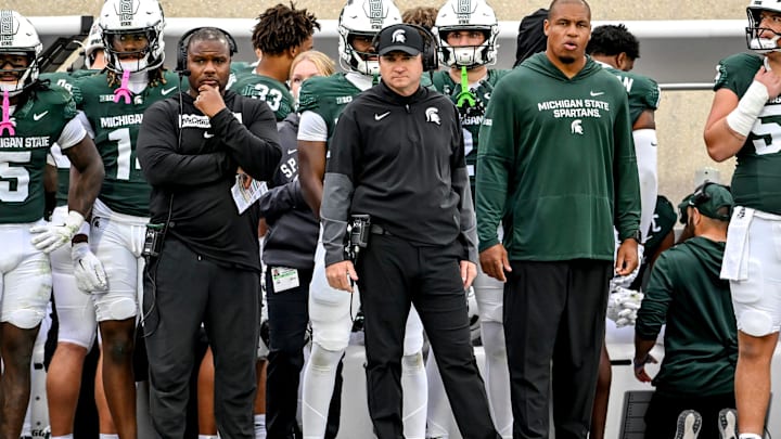 Michigan State's head coach Jonathan Smith, center, looks on from the sideline during the third quarter in the game against UCLA on Saturday, Oct. 11, 2025, at Spartan Stadium in East Lansing.