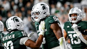 Michigan State's Jalen Thompson, right, celebrates his tackle for a safety against Western Michigan during the third quarter on Friday, Aug. 29, 2025, in East Lansing.