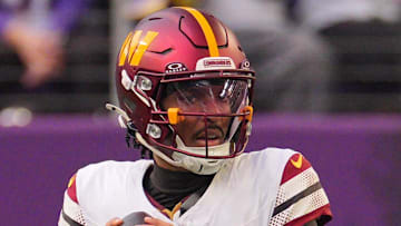 Dec 7, 2025; Minneapolis, Minnesota, USA; Washington Commanders quarterback Jayden Daniels (5) drops back to pass against the Minnesota Vikings during the second half at U.S. Bank Stadium. 