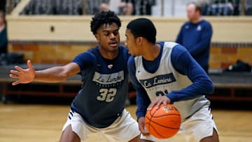 La Lumiere junior Jalen Haralson (32) defends teammate Ace Bucker during an open practice Thursday, Nov. 9, 2023, at the La Porte Civic Auditorium.
