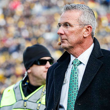 Nov 25, 2023; Ann Arbor, MI, USA;  Ohio State Buckeyes former head coach Urban Meyer walks by the end zone during the first half between Michigan and Ohio State at Michigan Stadium in Ann Arbor on Saturday, Nov. 25, 2023. 