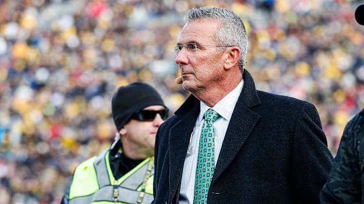 Nov 25, 2023; Ann Arbor, MI, USA;  Ohio State Buckeyes former head coach Urban Meyer walks by the end zone during the first half between Michigan and Ohio State at Michigan Stadium in Ann Arbor on Saturday, Nov. 25, 2023. 