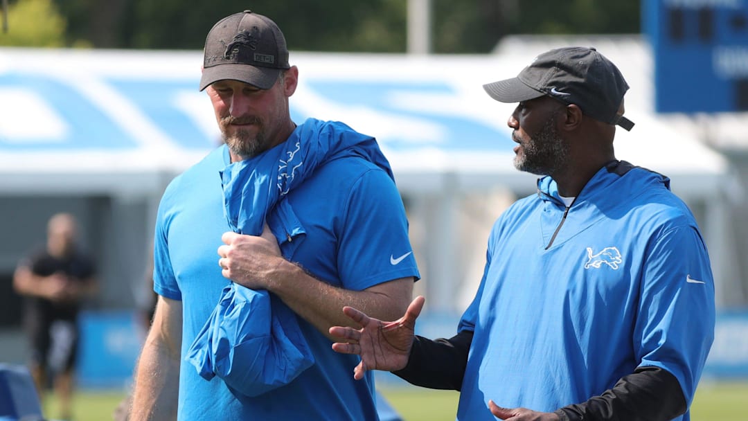 Lions GM Brad Holmes (right) and coach Dan Campbell talk after training camp in Allen Park on Thursday, July 29, 2021.

Lions
