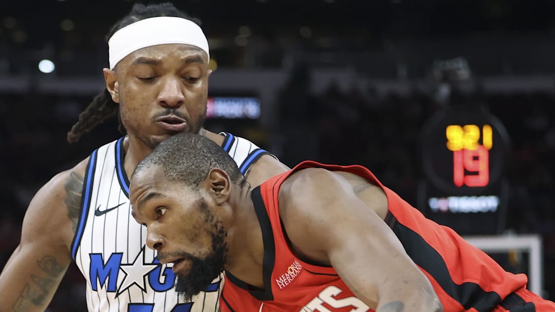 Nov 16, 2025; Houston, Texas, USA; Houston Rockets forward Kevin Durant (7) drives with the ball as Orlando Magic center Wendell Carter Jr. (34) defends during the first quarter at Toyota Center. Mandatory Credit: Troy Taormina-Imagn Images
