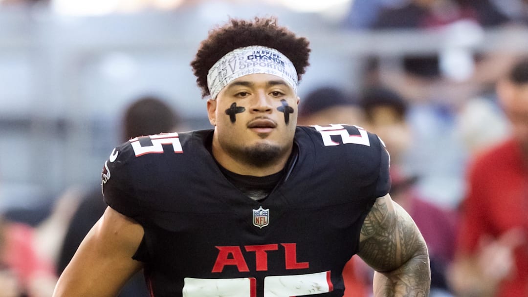 Dec 21, 2025; Glendale, Arizona, USA; Atlanta Falcons running back Tyler Allgeier (25) against the Arizona Cardinals at State Farm Stadium. Mandatory Credit: Mark J. Rebilas-Imagn Images