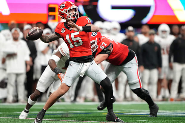 Georgia Bulldogs quarterback Carson Beck drops back to pass before being injured in the SEC title game.