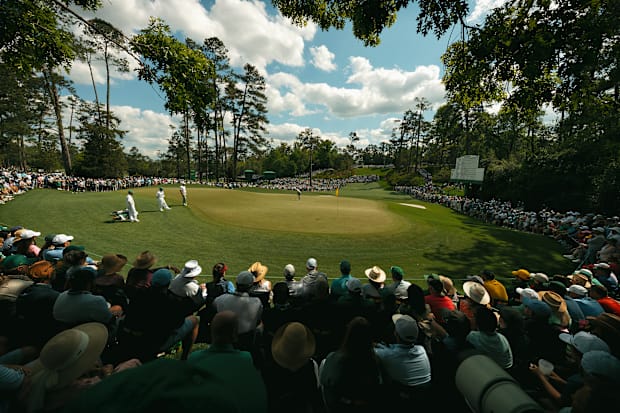 The crowd watches Rory McIlroy on the sixth green.