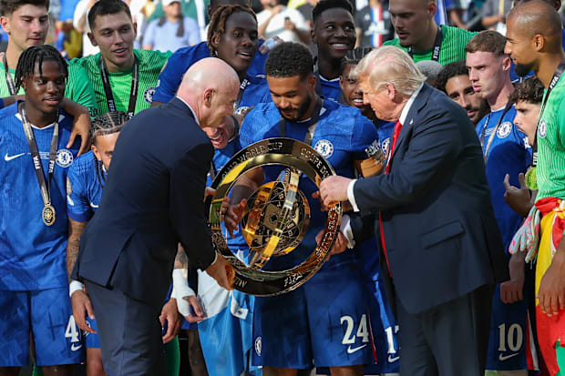 Gianni Infantino (left), Donald Trump (right) and Chelsea captain Reece James (center).