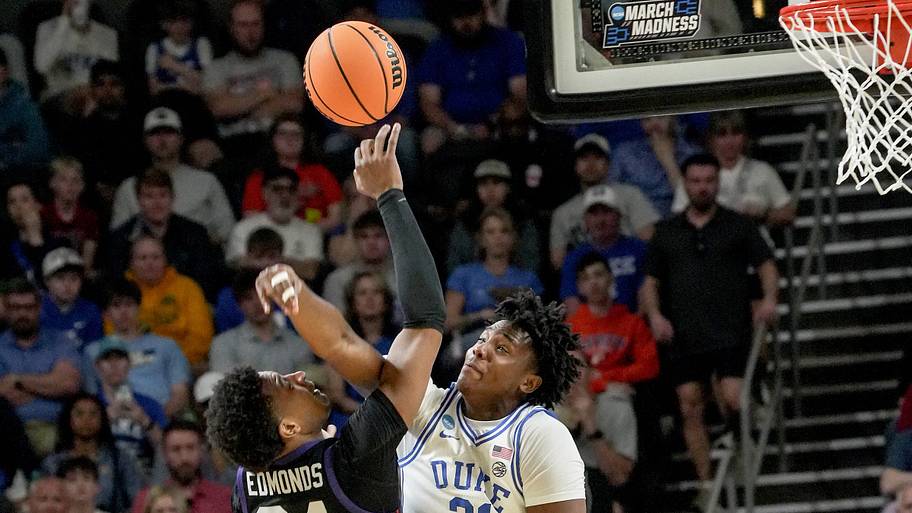 Duke center Patrick Ngongba II blocks the shot of TCU forward Xavier Edmonds during the NCAA tournament.
