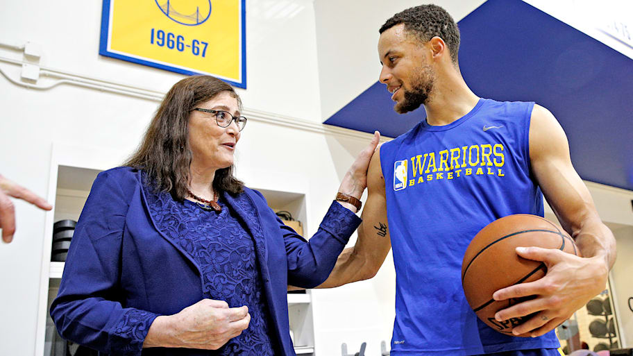 Denise Long Rife talks with Steph Curry at a Warriors practice in 2018.