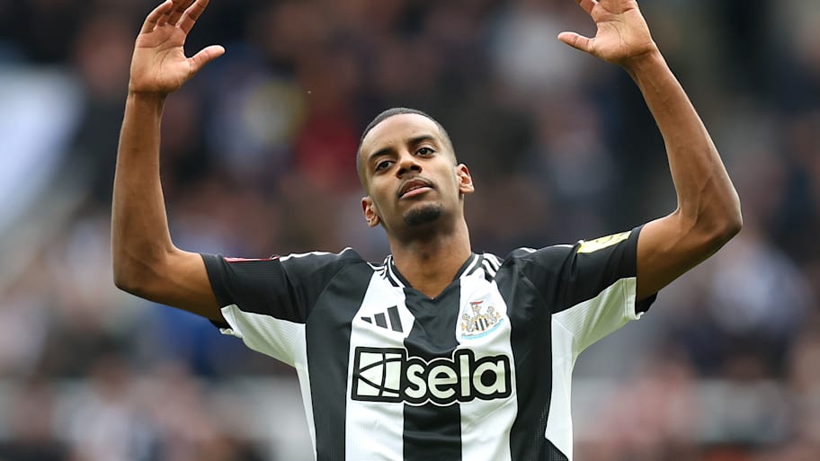 Alexander Isak with his arms raised.