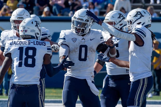 Akron players celebrate a touchdown.