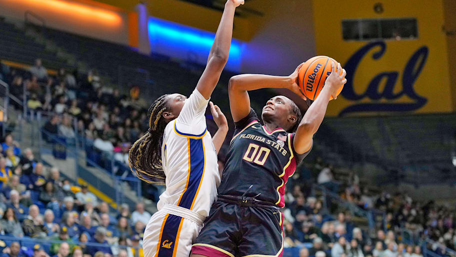 Florida State guard Ta’Niya Latson attempts to shoot the ball over a Cal defender.