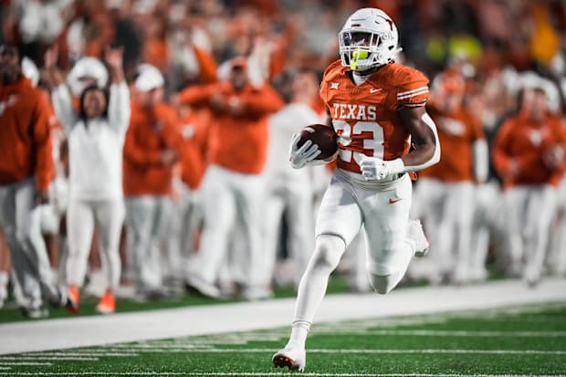 Texas running back Jaydon Blue runs the ball in to score a touchdown against the Texas Tech Red Raiders.