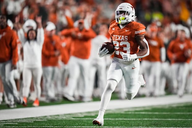 Texas running back Jaydon Blue runs the ball in to score a touchdown against the Texas Tech Red Raiders.