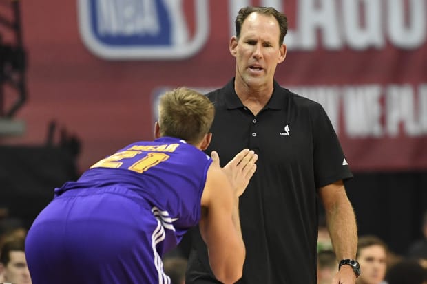 Jul 10, 2017; Las Vegas, NV, USA; Los Angeles Lakers Summer League head coach Jud Buechler talks with forward Travis Wear (21) on the sideline during an NBA Summer League game against the Sacramento Kings at Thomas & Mack Center. Mandatory Credit: Stephen R. Sylvanie-USA TODAY Sports