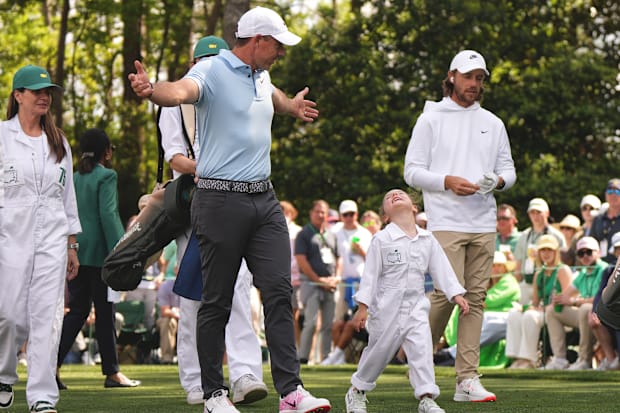 Rory McIlroy and his daughter Poppy walk together during the Masters' Par-3 Contest.