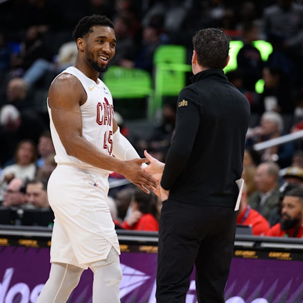 Donovan Mitchell (45) reacts on the sideline with Cleveland Cavaliers head coach Kenny Atkinson