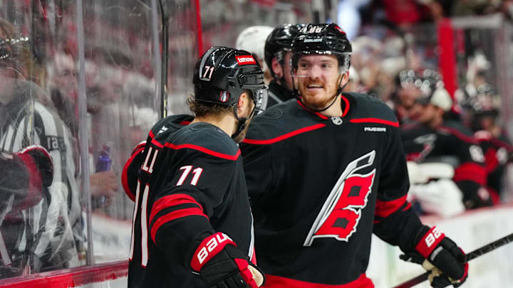 May 12, 2025; Raleigh, North Carolina, USA; Carolina Hurricanes left wing Taylor Hall (71) celebrates his goal with center Jack Roslovic (96) against the Washington Capitals during the third period in game four of the second round of the 2025 Stanley Cup Playoffs at Lenovo Center. Mandatory Credit: James Guillory-Imagn Images