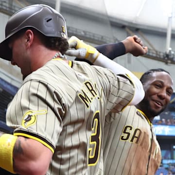 Sep 1, 2024; St. Petersburg, Florida, USA;  San Diego Padres outfielder Jackson Merrill (3) is congratulated by outfielder Jurickson Profar (10)  after he hit a 2-run home run against the Tampa Bay Rays during the fourth inning at Tropicana Field. Mandatory Credit: Kim Klement Neitzel-Imagn Images