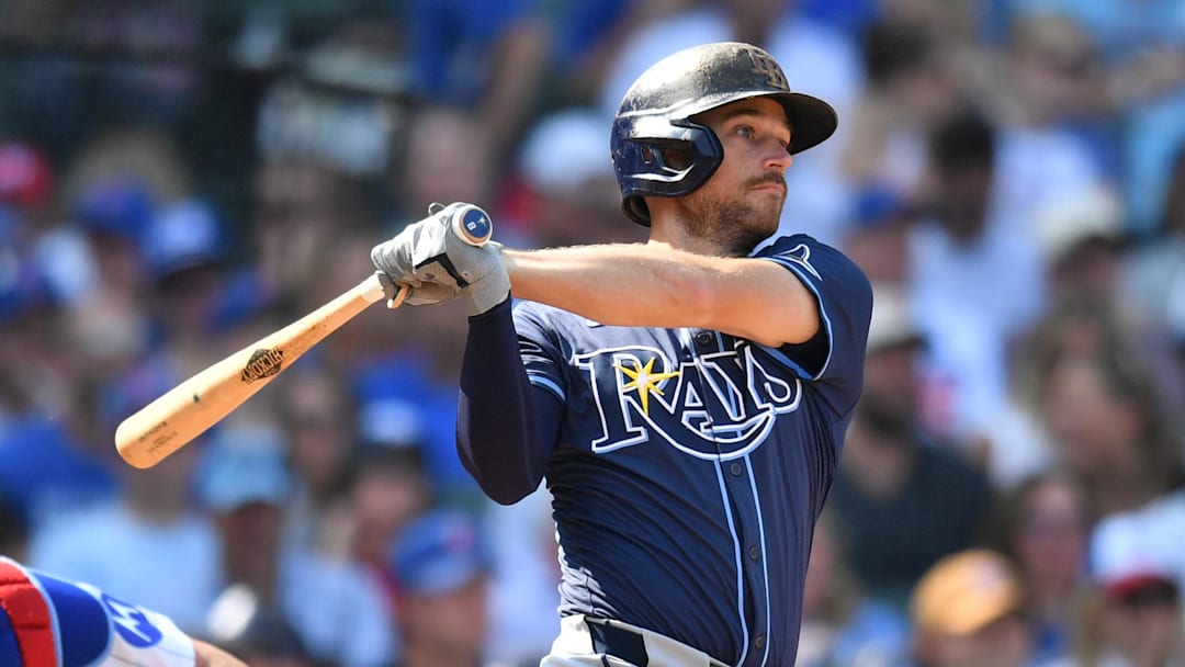 Sep 13, 2025; Chicago, Illinois, USA; Tampa Bay Rays second baseman Brandon Lowe (8) hits an RBI single against the Chicago Cubs during the sixth inning at Wrigley Field. Mandatory Credit: Patrick Gorski-Imagn Images