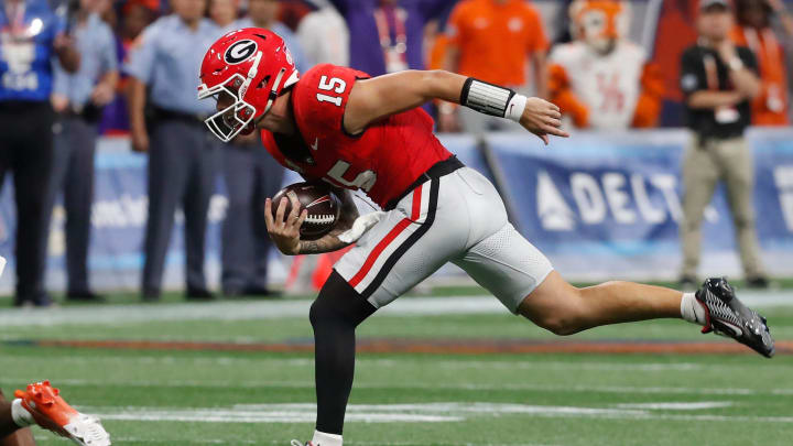 Georgia quarterback Carson Beck (15) runs the ball during the first half of the NCAA Aflac Kickoff Game against Clemson in Atlanta, on Saturday, Aug. 31, 2024.