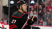 Mar 9, 2025; Raleigh, North Carolina, USA;  Carolina Hurricanes center Logan Stankoven (22) scores a goal against the Winnipeg Jets during the third period at Lenovo Center. Mandatory Credit: James Guillory-Imagn Images