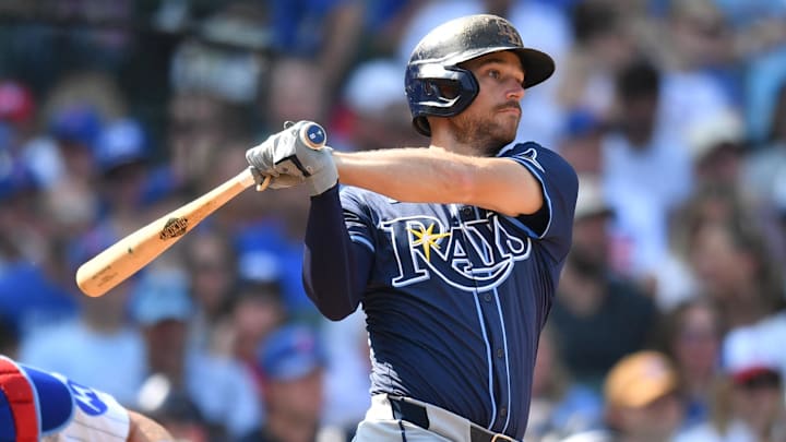 Sep 13, 2025; Chicago, Illinois, USA; Tampa Bay Rays second baseman Brandon Lowe (8) hits an RBI single against the Chicago Cubs during the sixth inning at Wrigley Field. Mandatory Credit: Patrick Gorski-Imagn Images