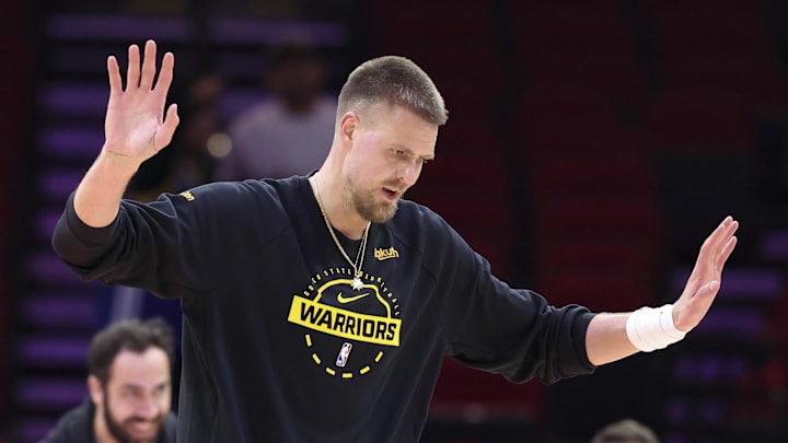 Mar 5, 2026; Houston, Texas, USA; Golden State Warriors center Kristaps Porzingis (7) reacts while warming up before the game against the Houston Rockets at Toyota Center. Mandatory Credit: Troy Taormina-Imagn Images
