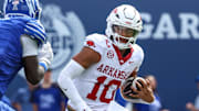 Arkansas Razorbacks quarterback Taylen Green (10) runs with the ball against the Memphis Tigers during the first half at Simmons Bank Liberty Stadium.